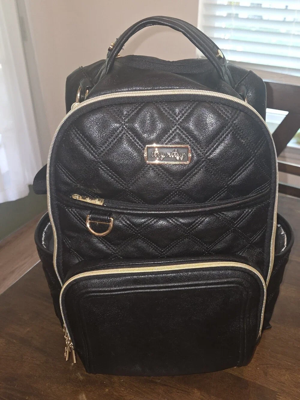 Itzy Ritzy Black Quilted Backpack Diaper Bag with Gold Hardware